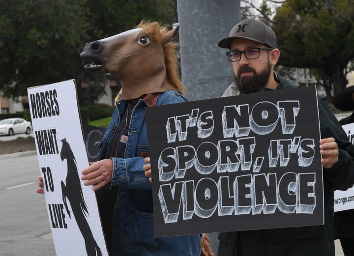 Animal-rights advocates protest the deaths of racehorses at the Santa Anita racetrack in Arcadia, California, on Sunday.