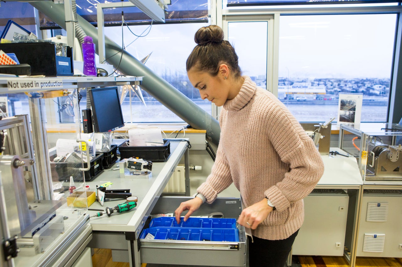 A woman works in the assembly department of Ossur, a Reykjavik-based company that makes prosthetics and has been certified as offering equal pay under a new law.