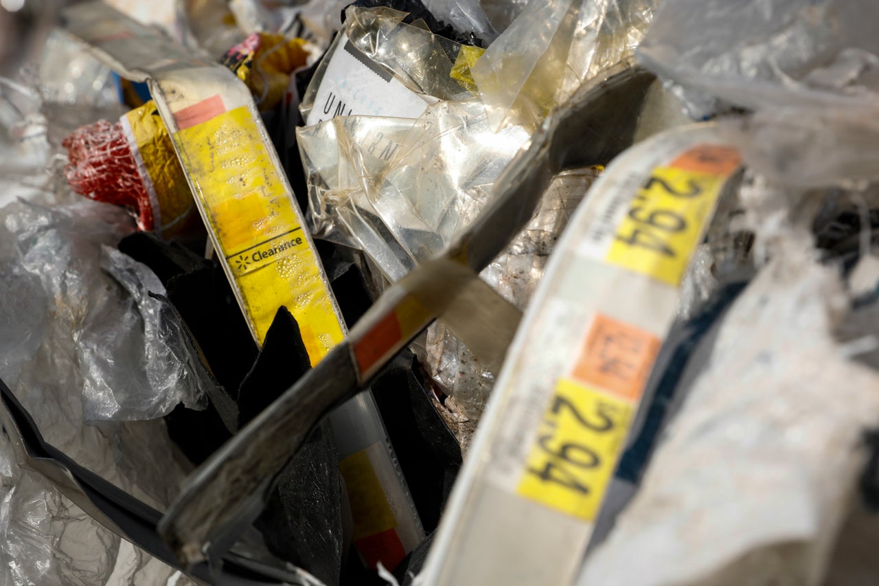 A Walmart clearance tag in a plastic bale at a dumpsite in Ipoh, Malaysia, Jan. 30. U.S. companies may make broad promises about reducing waste and promoting recycling but are often unaware of where their used products and packaging end up.