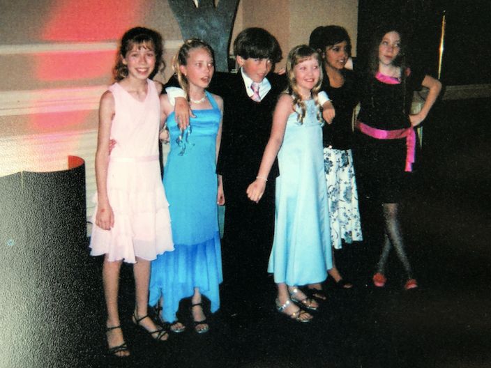 Me with my childhood friends Danielle Chuchran, Dylan Meyer, Megan, Tessa, and Caitlin Meyer at the Young Artist Awards in 2003. I was 12 and really struggling with anorexia, so any sort of social eating like at this luncheon was genuinely my nightmare. The woman sitting next to me at our table noticed I was fiddling with my roll instead of eating it and commented loudly, “You haven’t eaten a thing!” I seethed with anger that this woman almost blew my cover as a closeted anorexic.