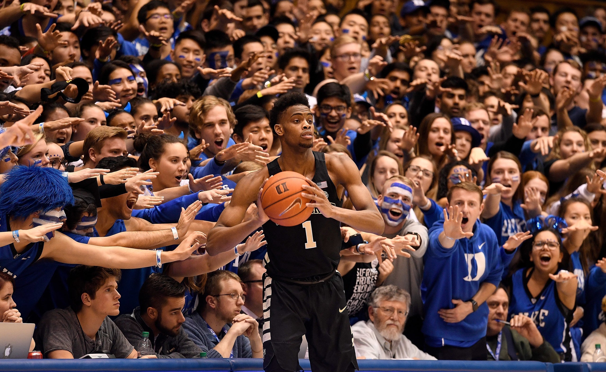 The Cameron Crazies taunt Isaiah Mucius #1 of the Wake Forest Demon Deacons during the second half of their game against the
