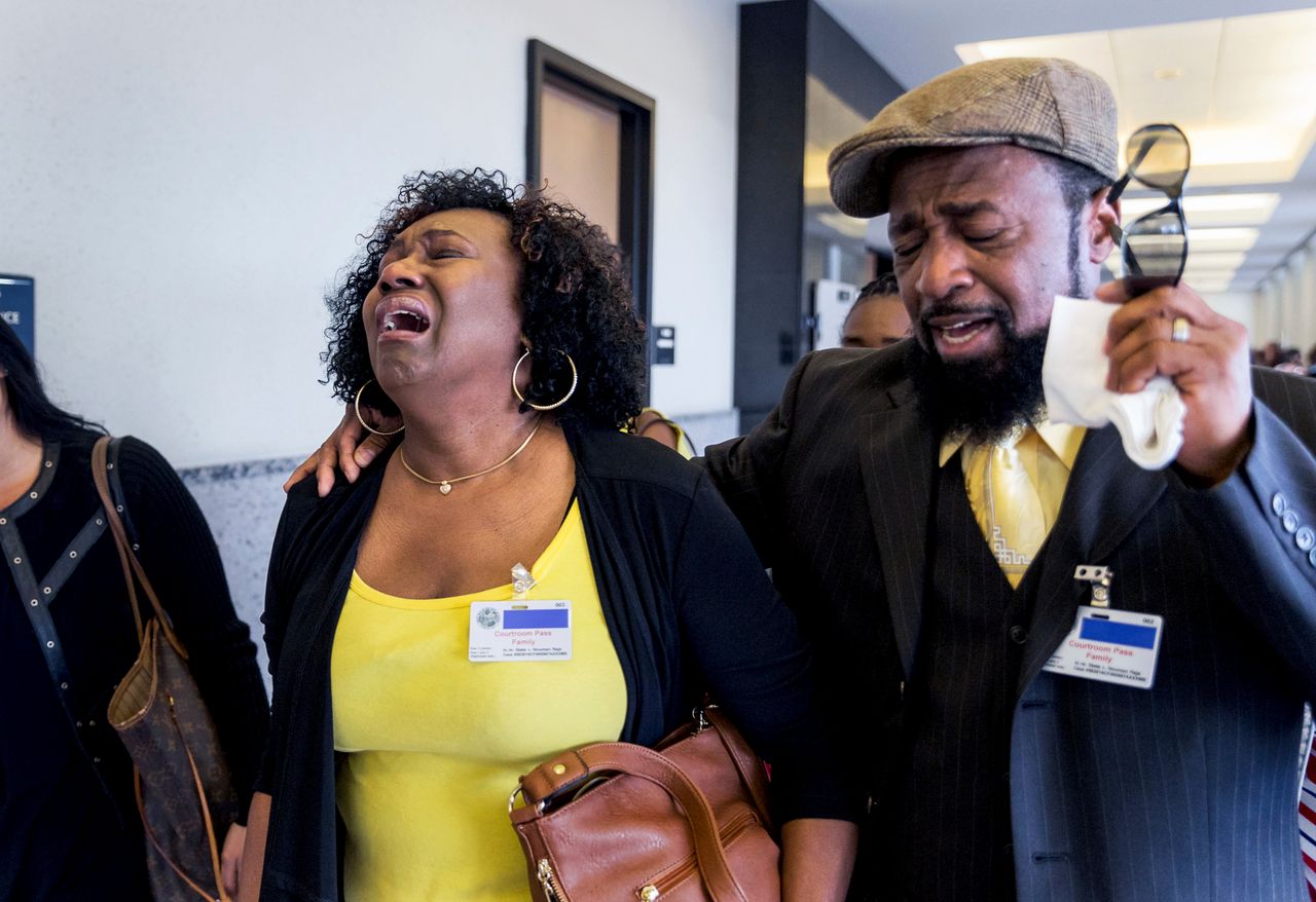 Kattie Jones and her husband, Clinton Jones, Sr., father of Corey Jones, walk down the hall from the courtroom after Nouman Raja was found guilty Thursday, March 7, 2019, in West Palm Beach. Raja, 41, faces a mandatory minimum of 25 years at sentencing April 26, and could spend his life in prison for the death of Corey Jones.