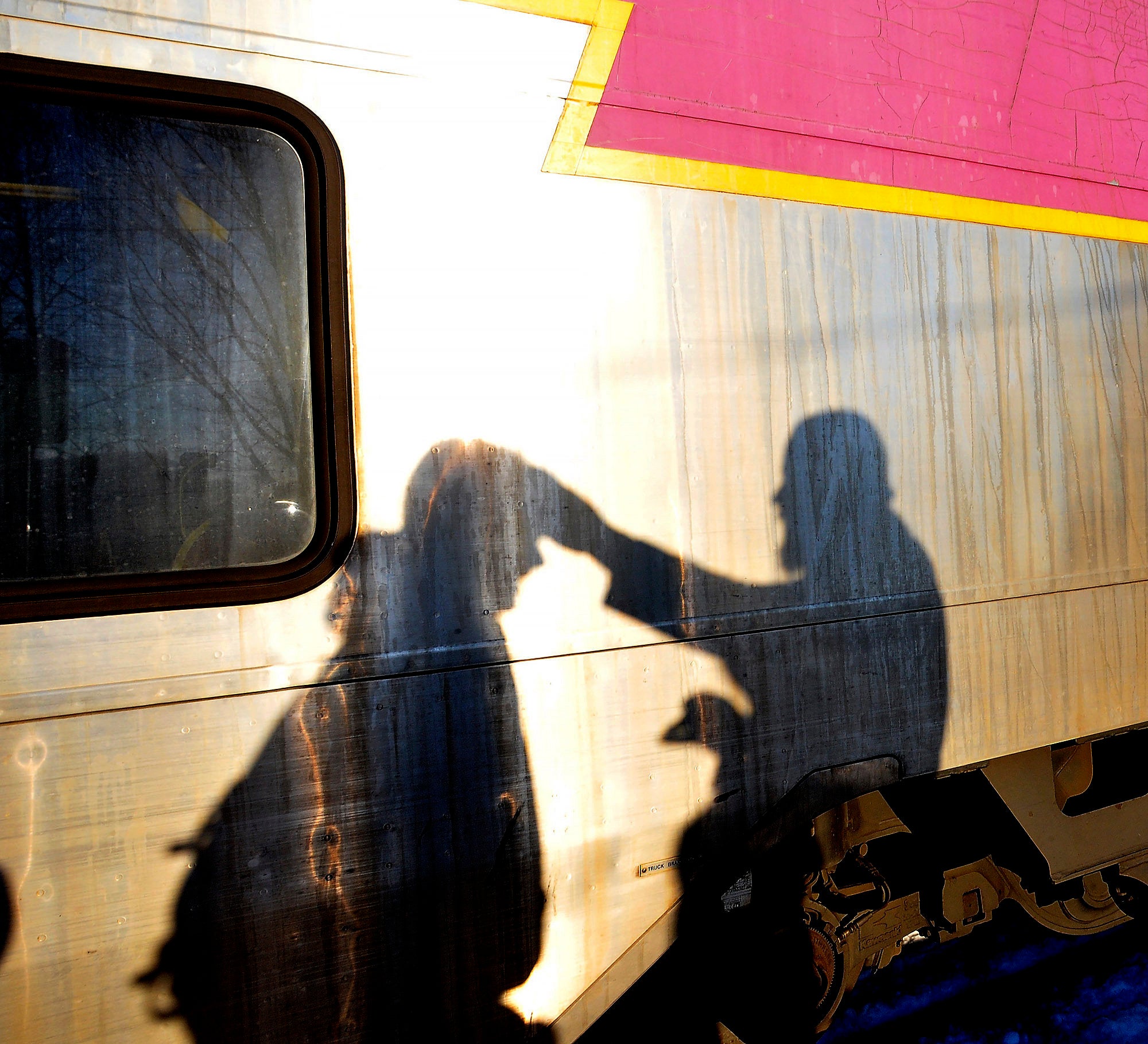 Father Chris Peschel of St. John's parish offers ashes to a commuter at the downtown Attleboro commuter station on Ash Wednes