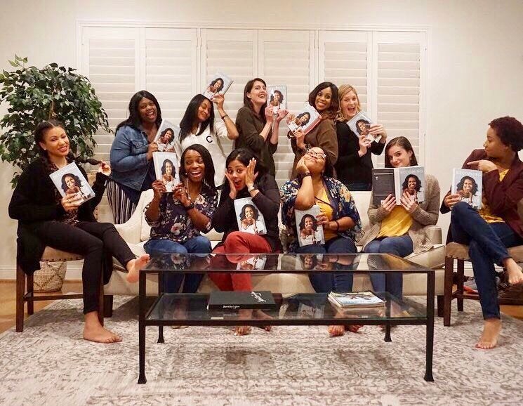 My HTX Book and Brunch club posing with copies of Becoming.