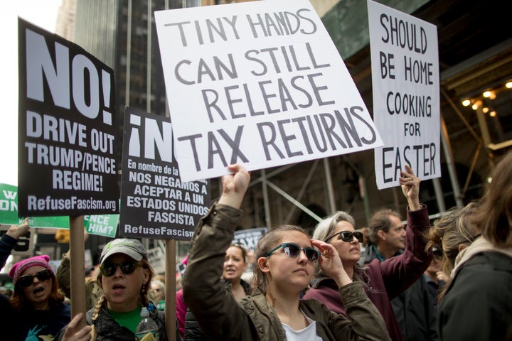 Protesters at nationwide Tax Day protests in April 2017 demanded Trump release his tax returns.