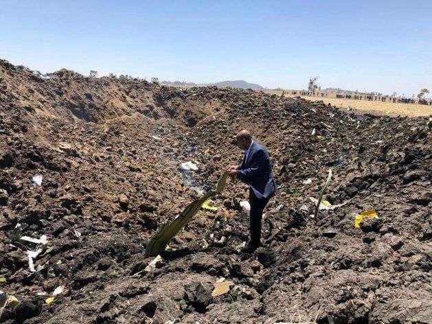 In this photo taken from the Ethiopian Airlines Facebook page, the CEO of Ethiopian Airlines, Tewolde Gebremariam, looks at the wreckage of the plane that crashed shortly after takeoff from Addis Ababa, Ethiopia, on March 10, 2019.