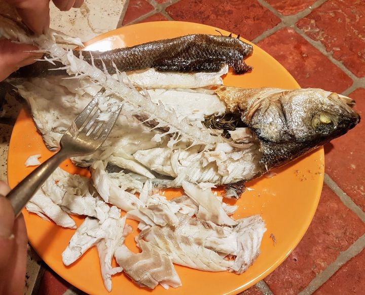 When presenting a whole fish, make sure you remove all the bones -- but whether you leave the head on is up to you.