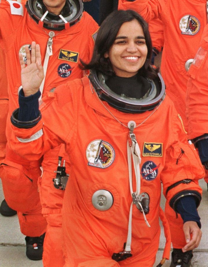 Kalpana Chawla waves to well-wishers as she leaves the Kennedy Space Center's crew quarters to board the shuttle Columbia for launch.