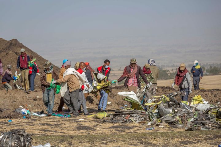 Rescuers work at the scene of an Ethiopian Airlines flight crash near Bishoftu, or Debre Zeit, south of Addis Ababa, Ethiopia on Monday.