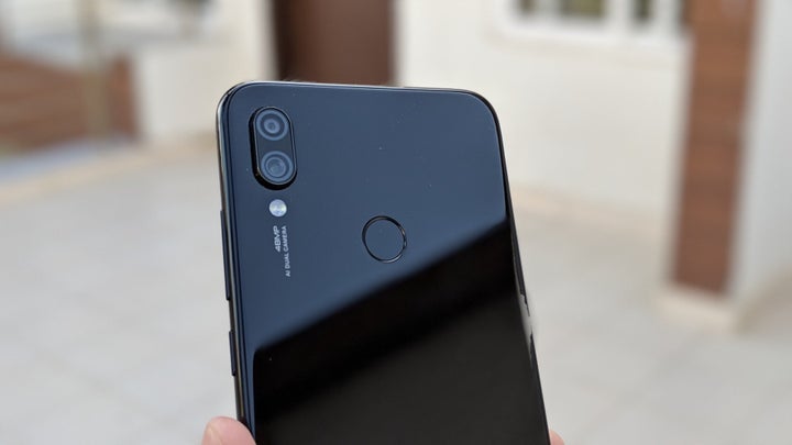 Redmi Note 7 Pro rear view of cameras and fingerprint sensor.