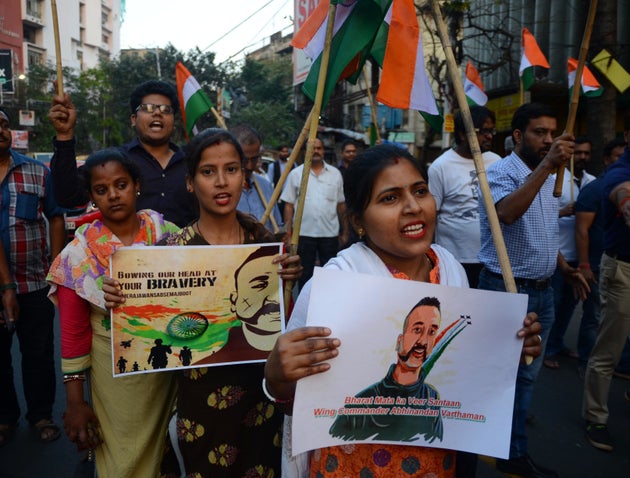 People celebrate the return of Indian Air Force (IAF) pilot Wing Commander Abhinandan