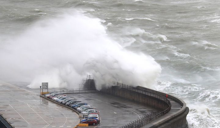 Waves crash onto cars on the harbour arm at the Port of Dover in Kent as Storms Gareth sweeps across the country.