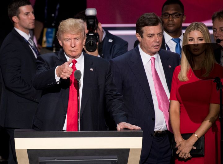 Paul Manafort (right in pink tie) seen next to Donald Trump before the billionaire accepted the Republican nomination for President in 2016.