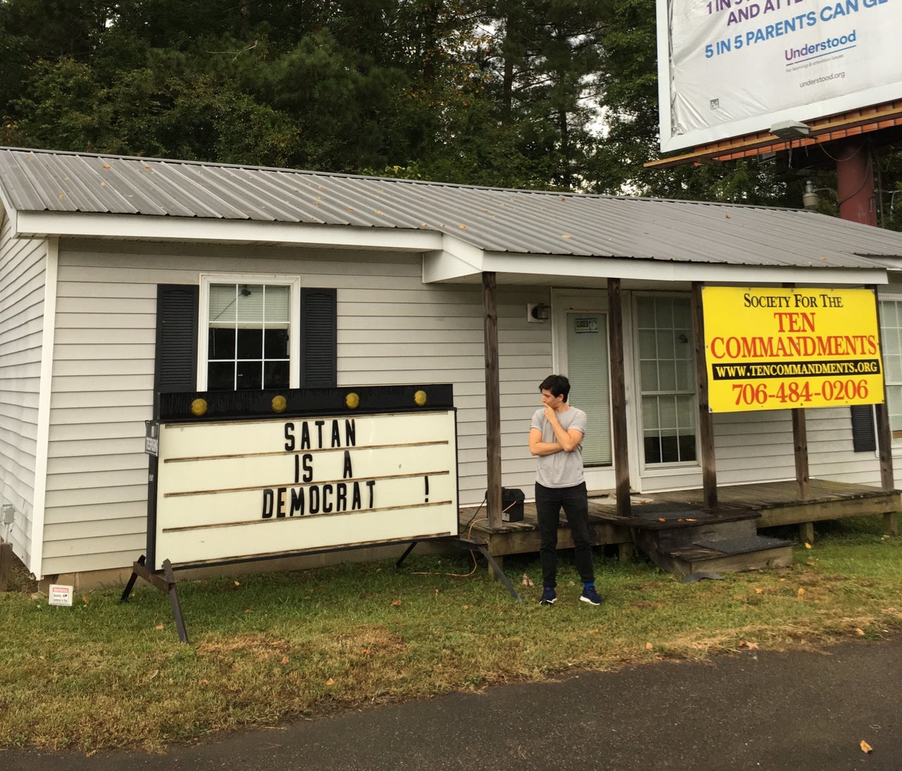 Plaut scrutinizing a local church sign in Milledgeville, Georgia, in September 2018.