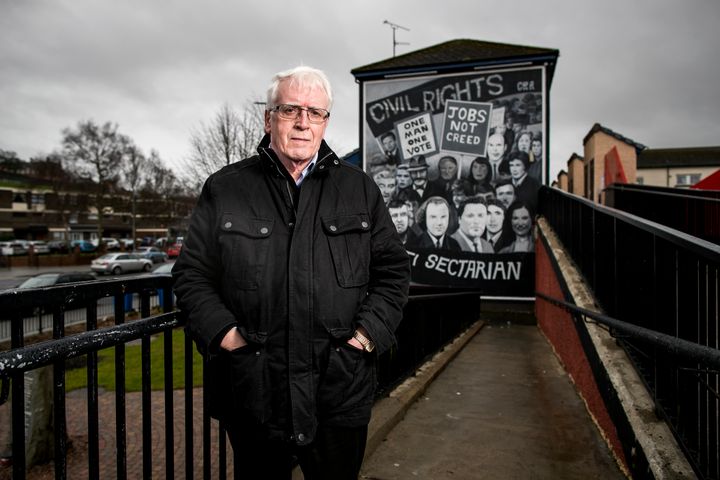 John Kelly whose brother 17 year old Michael was killed in Derry on Bloody Sunday standing beside the Civil Rights Bogside mural. 