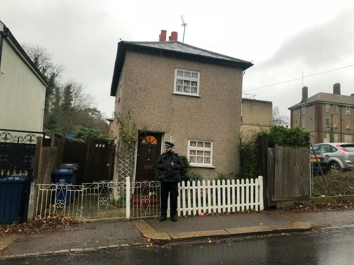 Police outside the pensioner's home in Barnet, north London 