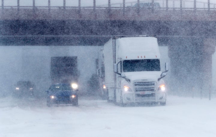 Traffic stops in the eastbound lanes of Interstate 70 near Tower Road as a late winter storm packing hurricane-force winds and snow sweeps over the intermountain West Wednesday, March 13, 2019, in Auora, Colo. 