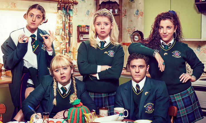 Derry Girls - Orla, Erin, Michelle at the back and Clare and James sitting down