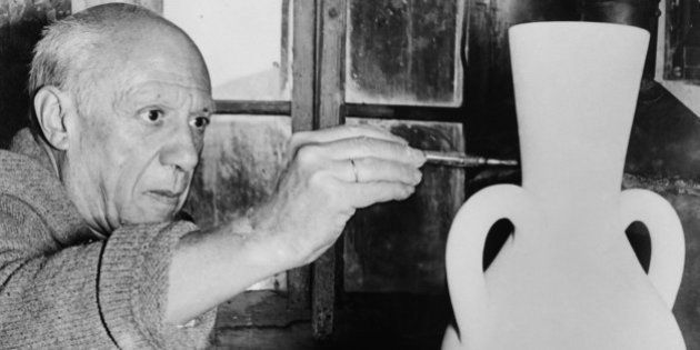 A photo taken on October 22, 1961 shows Spanish artist Pablo Picasso painting a potery at the Madoura studio in Vallauris. AFP PHOTO (Photo credit should read ANDRE VILLERS/AFP/Getty Images)