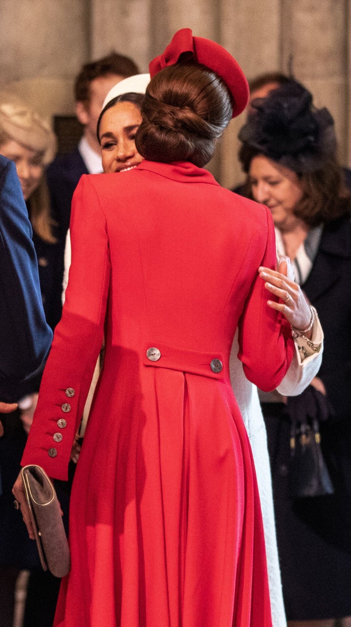 The two women embracing. 