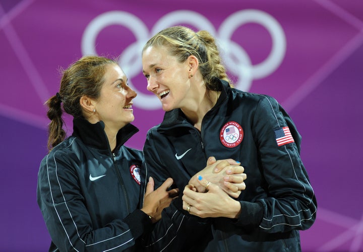 The book holds gold medallists Misty May-Treanor and Kerri Walsh Jennings as great examples of work wives. Here, the pair celebrate on the podium during the medal ceremony for the women's beach volleyball at the London 2012 Olympic Games.