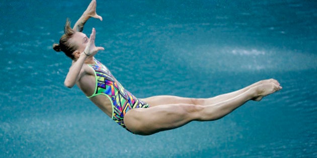 Russia's Nadezhda Bazhina competes during the women's 3-meter springboard diving preliminary round in the Maria Lenk Aquatic Center at the 2016 Summer Olympics in Rio de Janeiro, Brazil, Friday, Aug. 12, 2016. (AP Photo/Wong Maye-E)