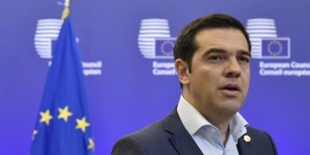 Greek Prime Minister Alexis Tsipras answers journalists' questions after an EU summit at the EU headquarters...