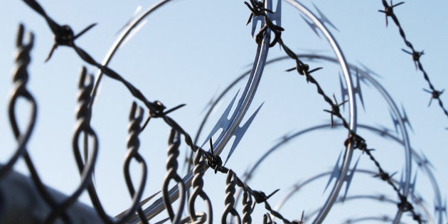 barbwire and metal fence