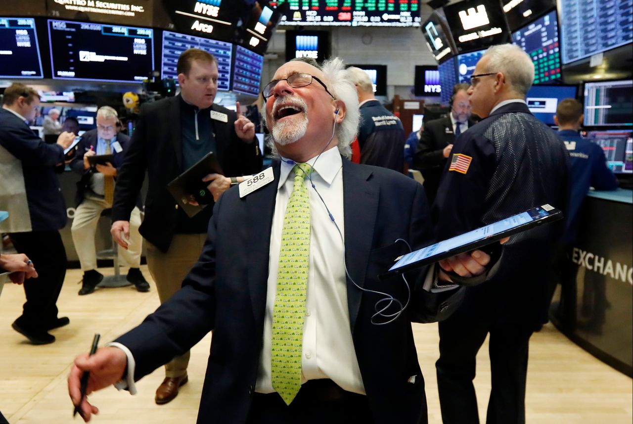 Trader Peter Tuchman laughs as he works on the floor of the New York Stock Exchange on March 13, 2019. U.S. stocks opened broadly higher on Wall Street Wednesday, powered by technology and health care companies.
