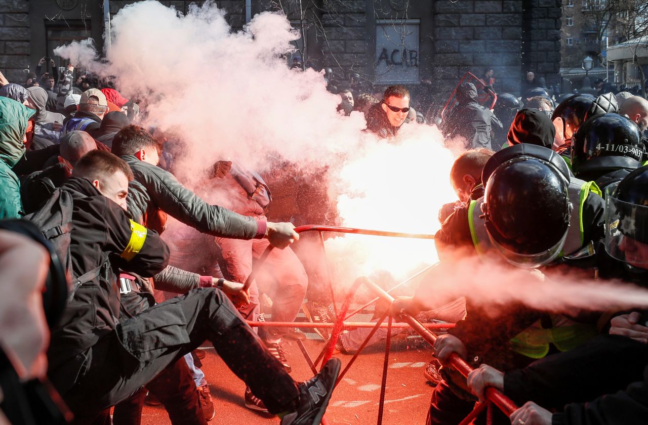 Members of Ukrainian nationalist parties scuffle with police officers during a rally to demand an investigation into the corruption of Ukraine's armed forces in Kiev, Ukraine, on March 9, 2019.