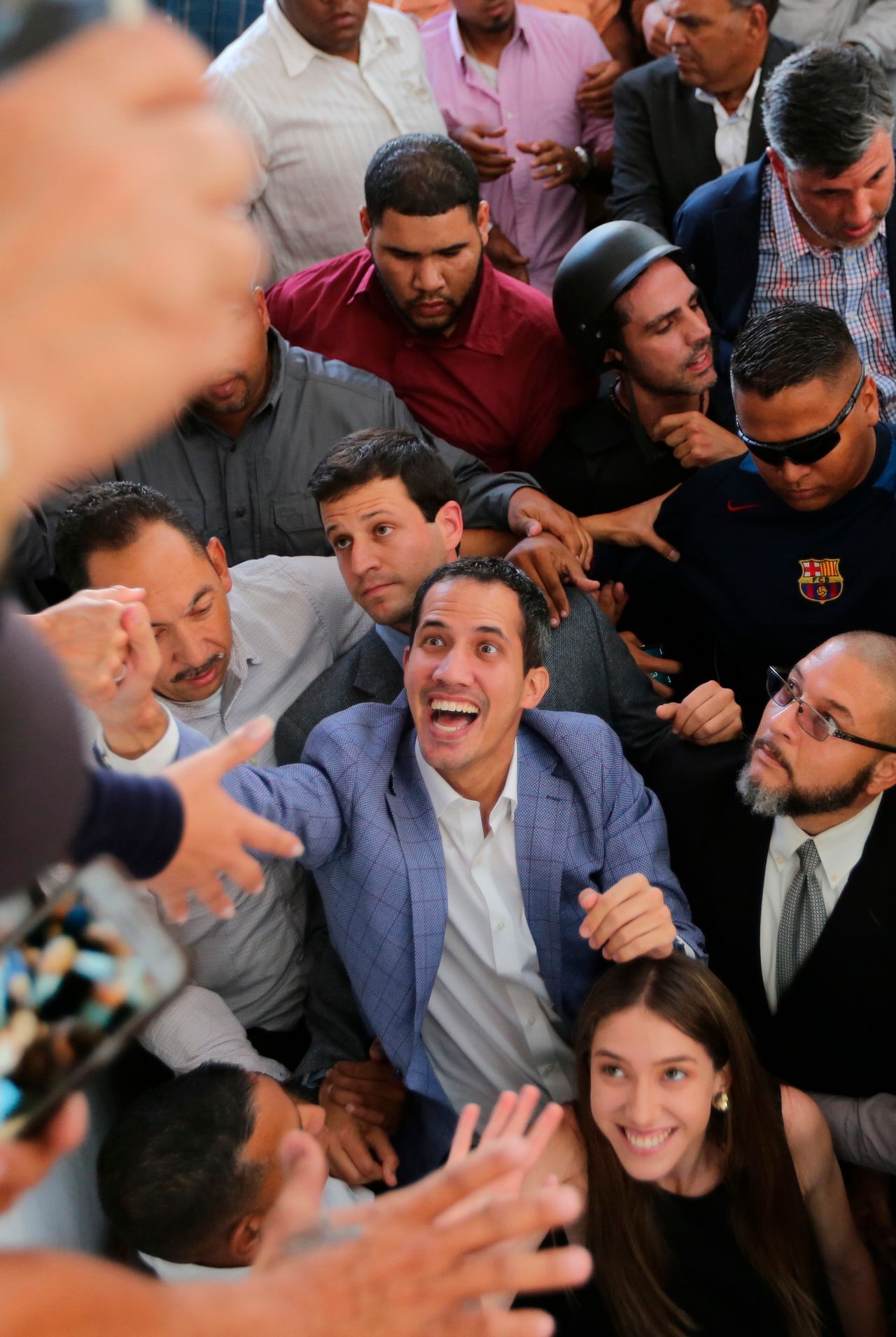 Venezuelan National Assembly President Juan Guaidó greets supporters in the Hatillo municipality of Caracas, Venezuela, on March 14, 2019. Guaidó has declared himself interim president and demands new elections, arguing that President Nicolás Maduro's re-election last year was invalid.