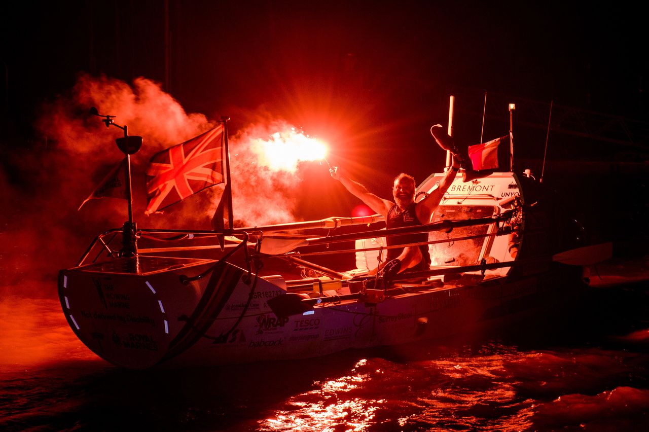Lee Spencer, a 49-year-old single-leg amputee, celebrates as he becomes the world’s first physically disabled person to row solo across the Atlantic, completing the feat in 60 days, on March 11, 2019, in Cayenne, French Guiana. 