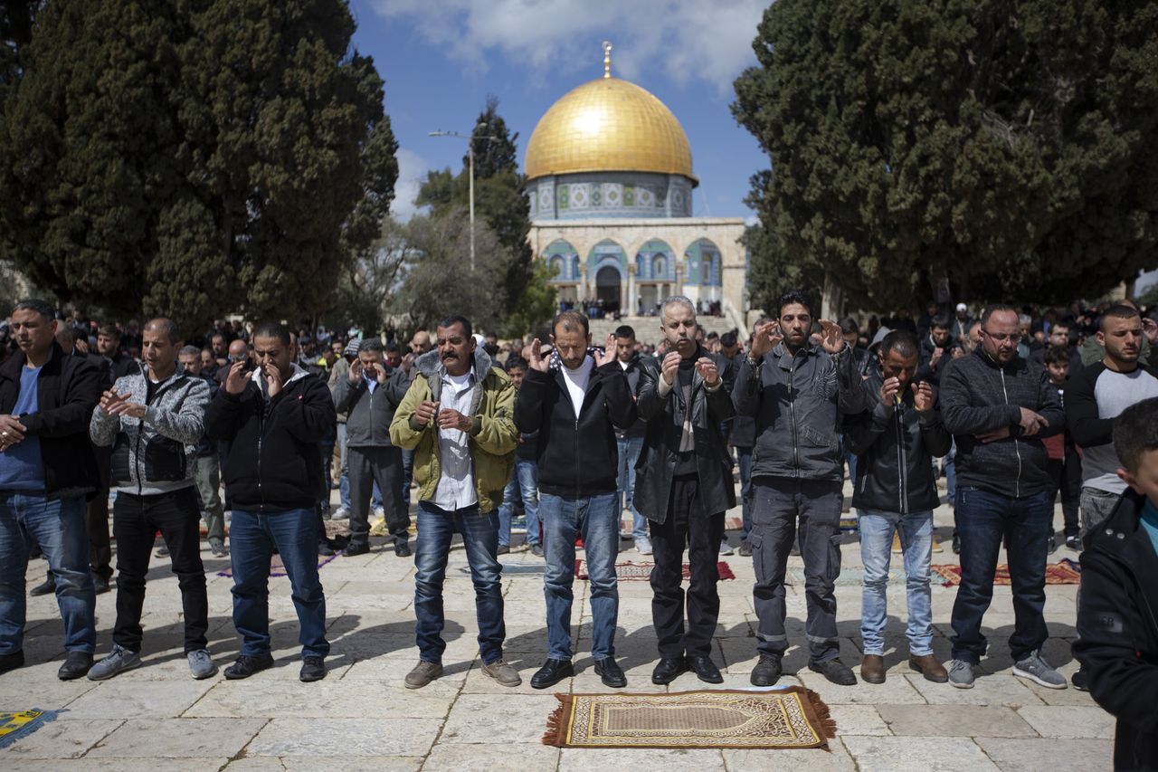 Palestinians perform funeral prayer in absentia for those who lost their lives during twin terror attacks in New Zealand mosques after performing Friday prayer at Masjid al-Aqsa in Jerusalem on March 15, 2019.