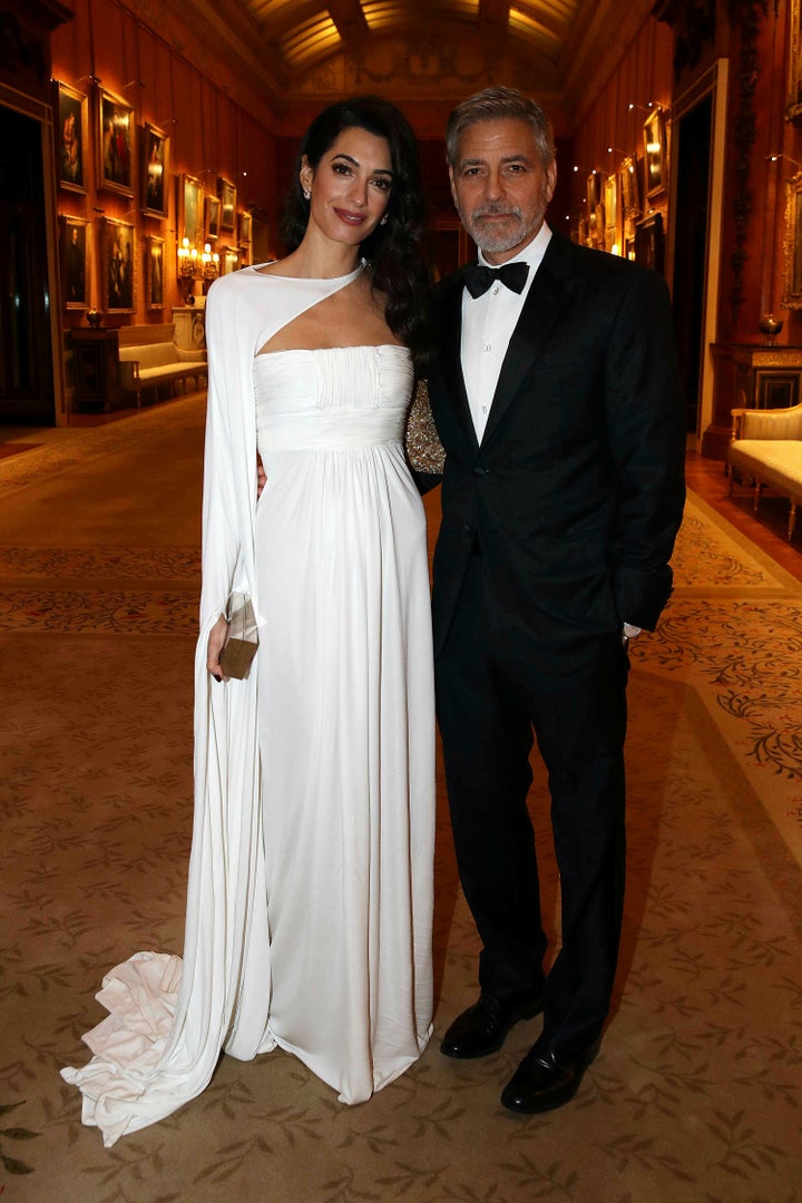 Amal and George Clooney attend a dinner to celebrate The Prince's Trust, hosted by Prince Charles, at Buckingham Palace on March 12 in London. 