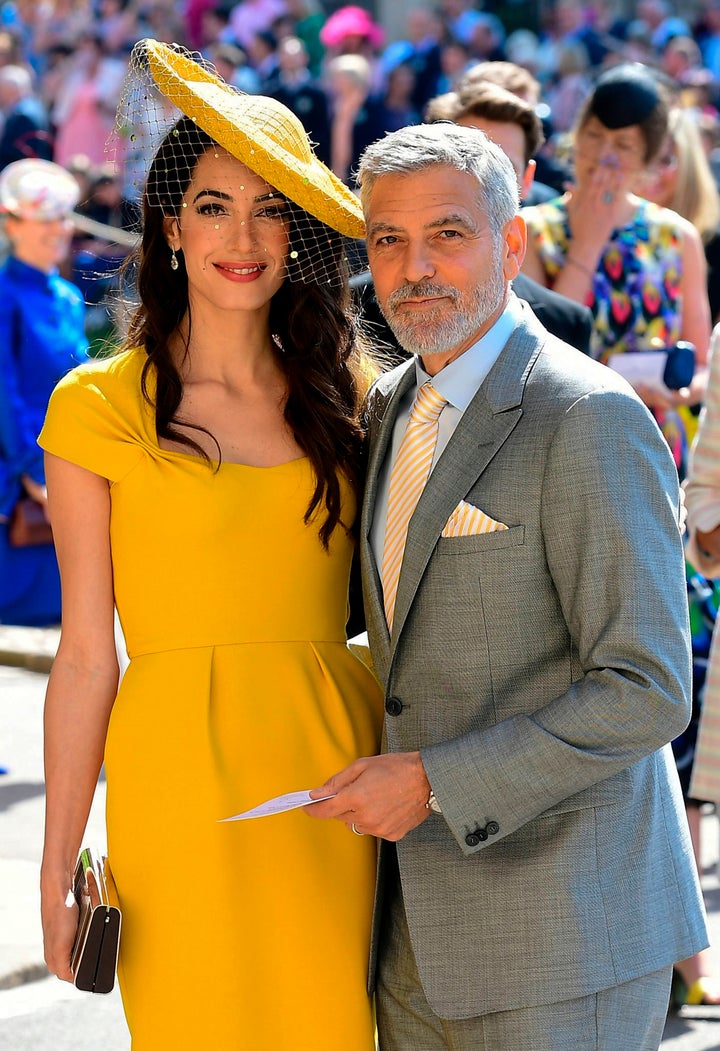 Amal and George Clooney pose together on the day of the royal wedding at St George's Chapel, Windsor Castle, in Windsor, on May 19. 