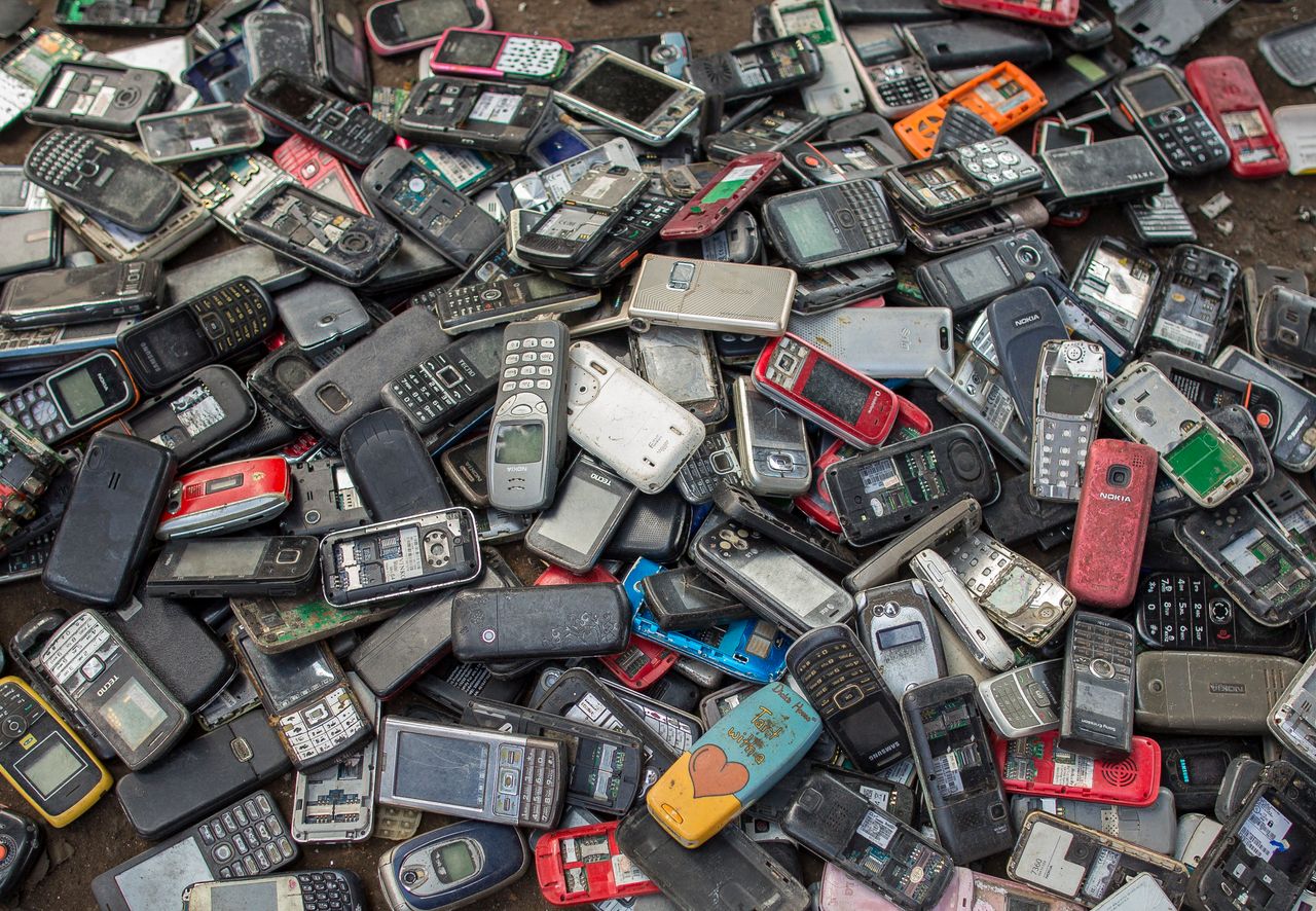 Old mobile phones piled up at a scrapyard in Ghana's capital city, Accra. Last year, Apple alone sold more than 217 million iPhones.