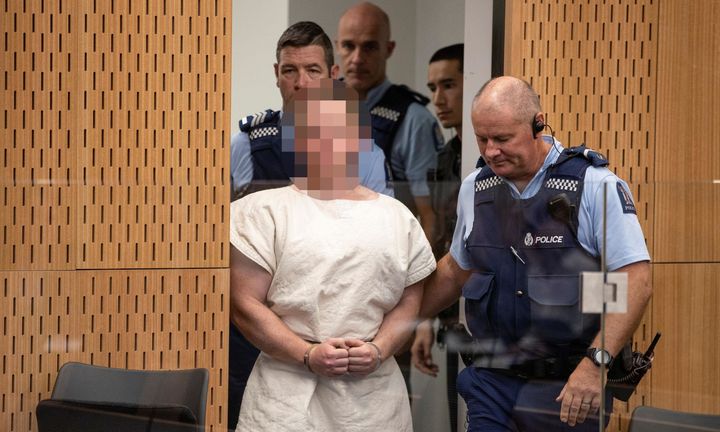 Brenton Tarrant, charged for murder in relation to the mosque attacks, is led into the dock for his appearance in the Christchurch district court on Saturday.
