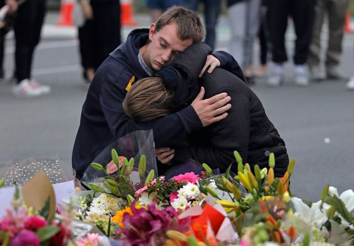 Mourners pay their respects at a makeshift memorial near the Masjid Al Noor mosque in Christchurch, New Zealand on Saturday.