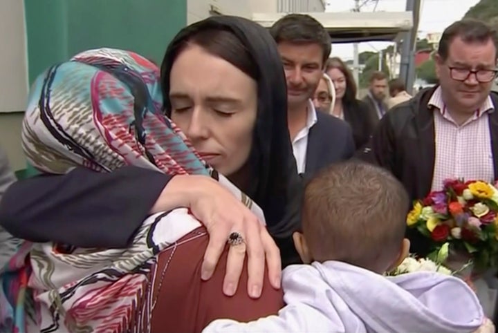 New Zealand's prime minister, Jacinda Ardern, consoles a Muslim woman on Sunday in the wake of Friday's mosque attacks.