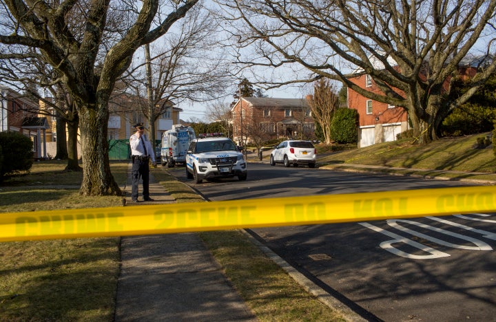 Police watch over the crime scene of the home of alleged Gambino family mafia crime boss Frank Cali following his shooting death on Wednesday.