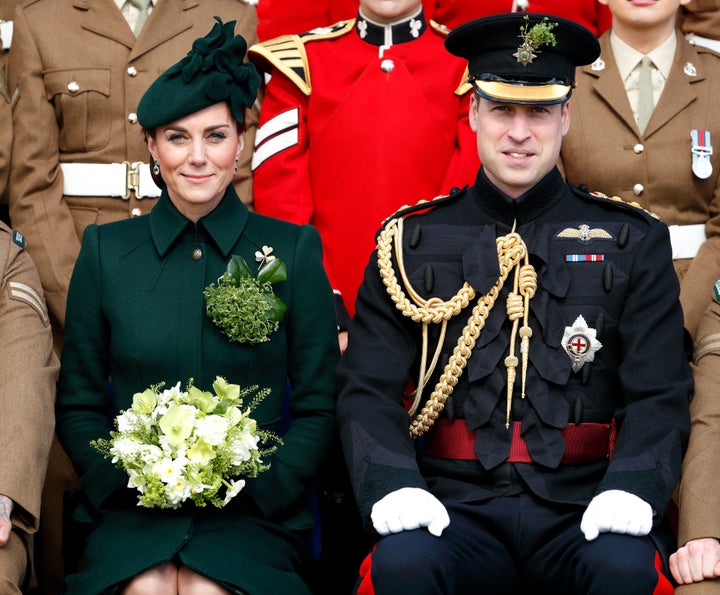 The Duke and Duchess of Cambridge posing for a regiment photo. 