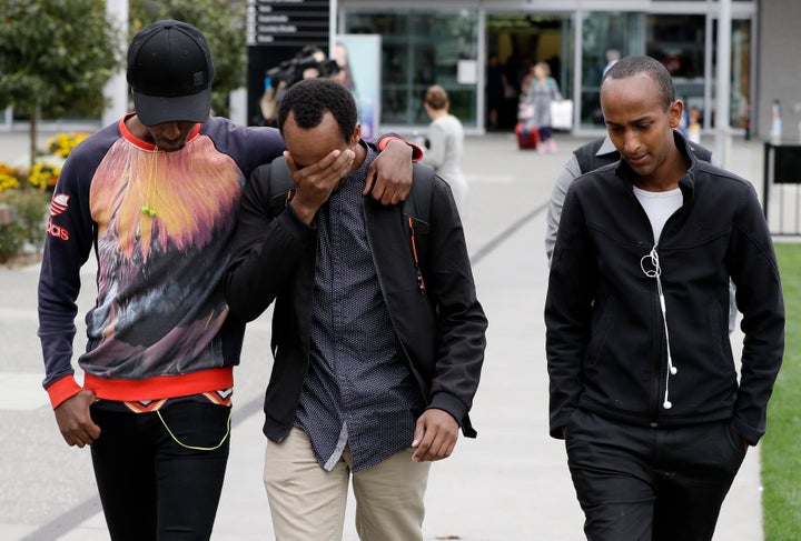 Mucad's elder brothers Abdifatah Ibrahim (center) and Abdi Ibrahim (right) with an unidentified friend in Christchurch, March 17. 