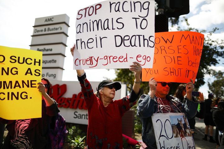 Animal rights activists protest horse racing deaths outside Santa Anita Park on March 10 in Arcadia, California.