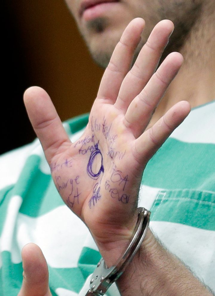 Anthony Comello's hand was covered in pro-Trump messages penned with blue ink.