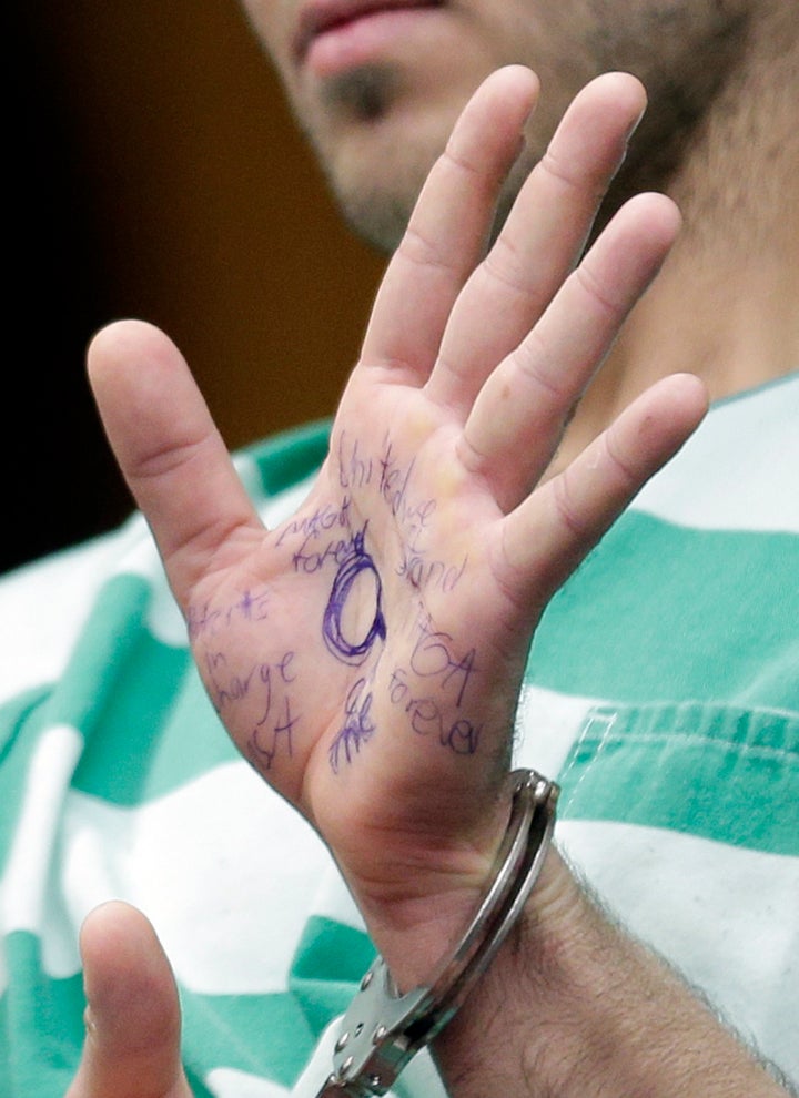 Anthony Comello's hand was covered in pro-Trump messages penned with blue ink.