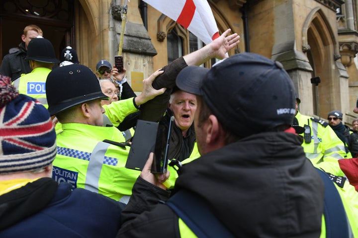 Police officers arrive at the Attorney General’s Office on Victoria Street in London, after a group of yellow vest protestors stormed the building.