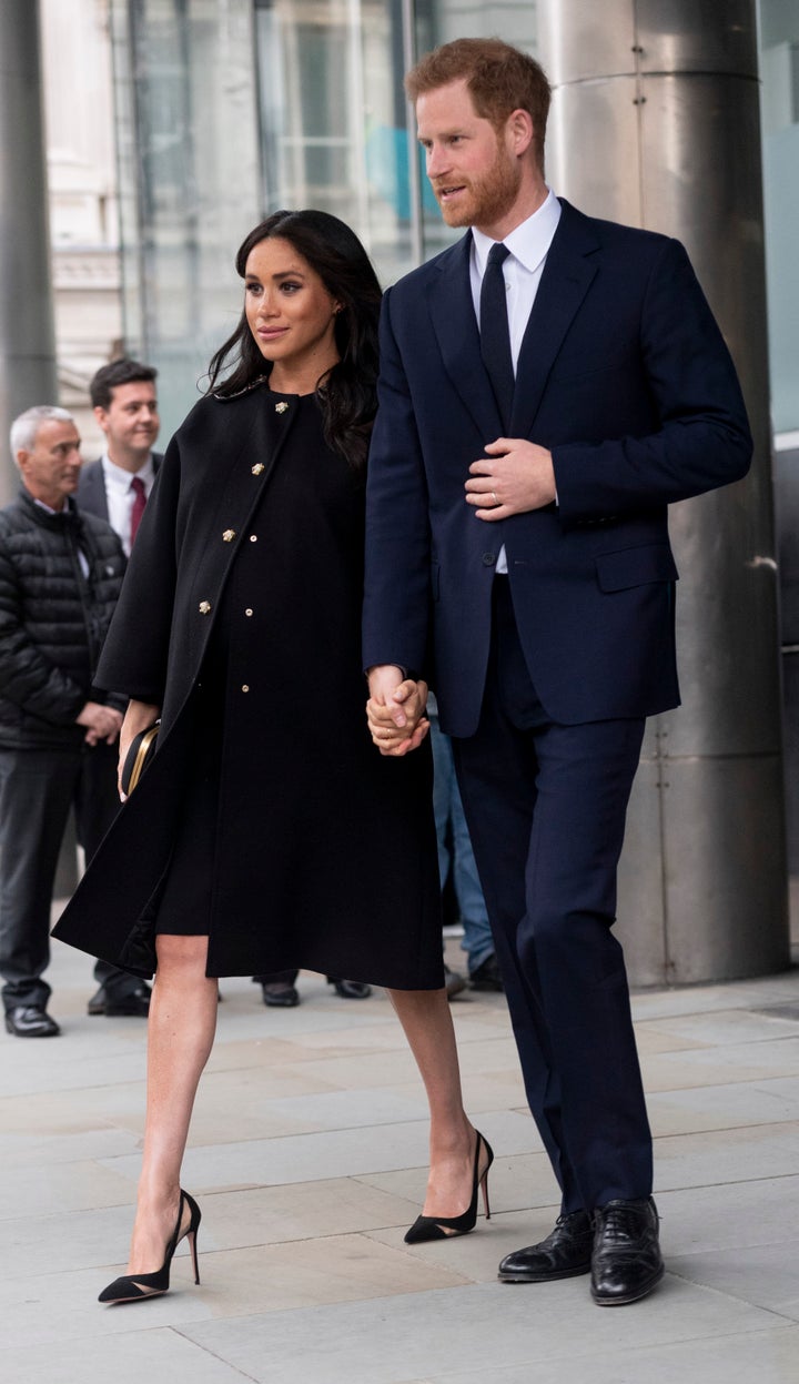 Meghan, Duchess of Sussex and Prince Harry, Duke of Sussex sign a book of condolences on behalf of the Royal Family at New Ze
