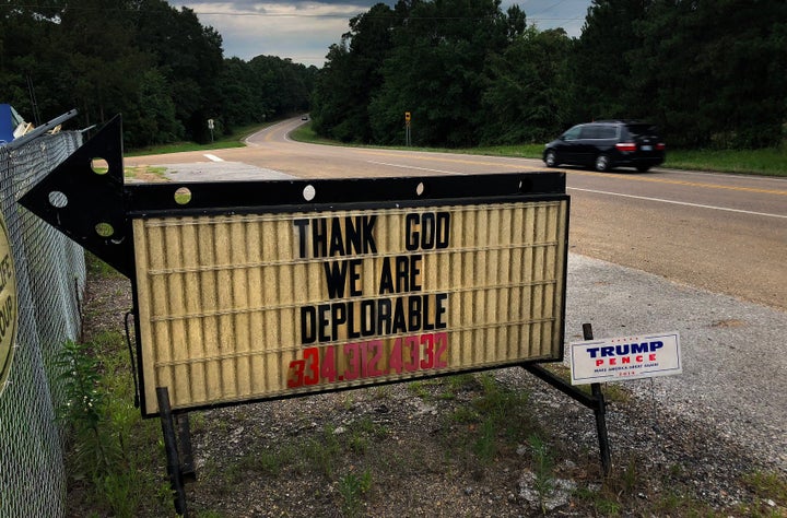 A sign connecting religious and political themes is seen on back roads near Luverne, Alabama in July 2018.