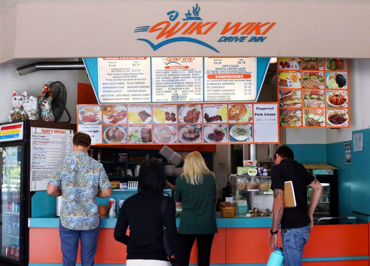 Customers line up at the Wiki Wiki Drive Inn takeout restaurant counter in Honolulu. Hawaii would be the first state to ban most plastics used at restaurants, if legislation lawmakers are considering is enacted.