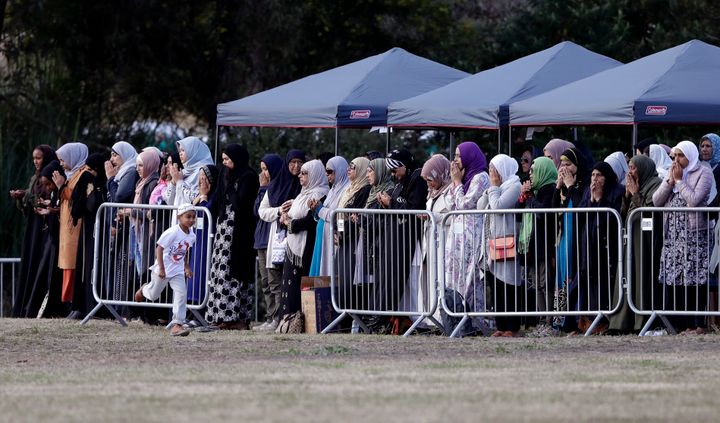 Women mourners pray during a funeral of a Friday March 15 mosque shooting victim at the Memorial Park Cemetery in Christchurch, New Zealand.